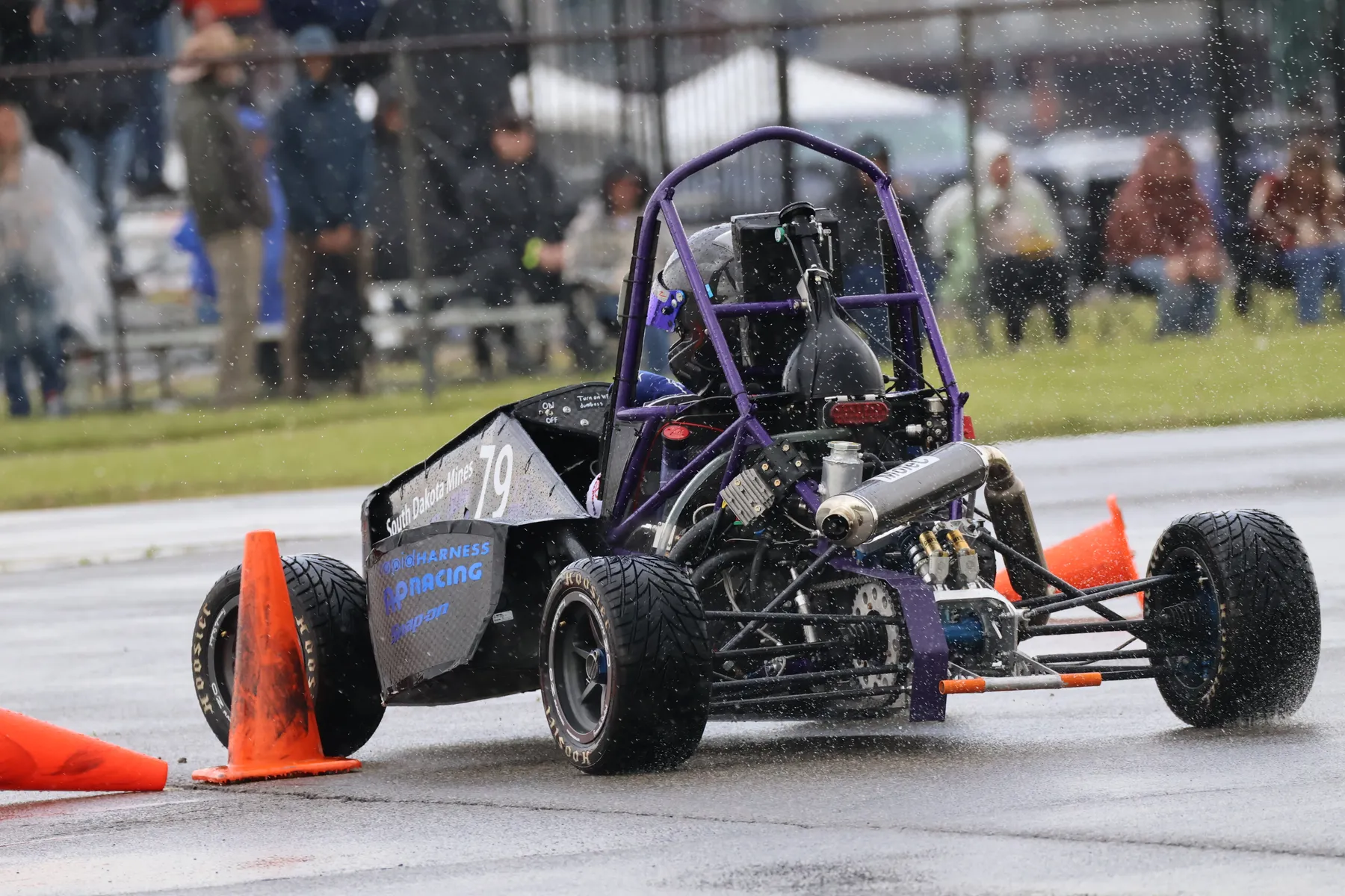 Formula Hardrocker Racing car 79 driving through heavy rain during the endurance event.