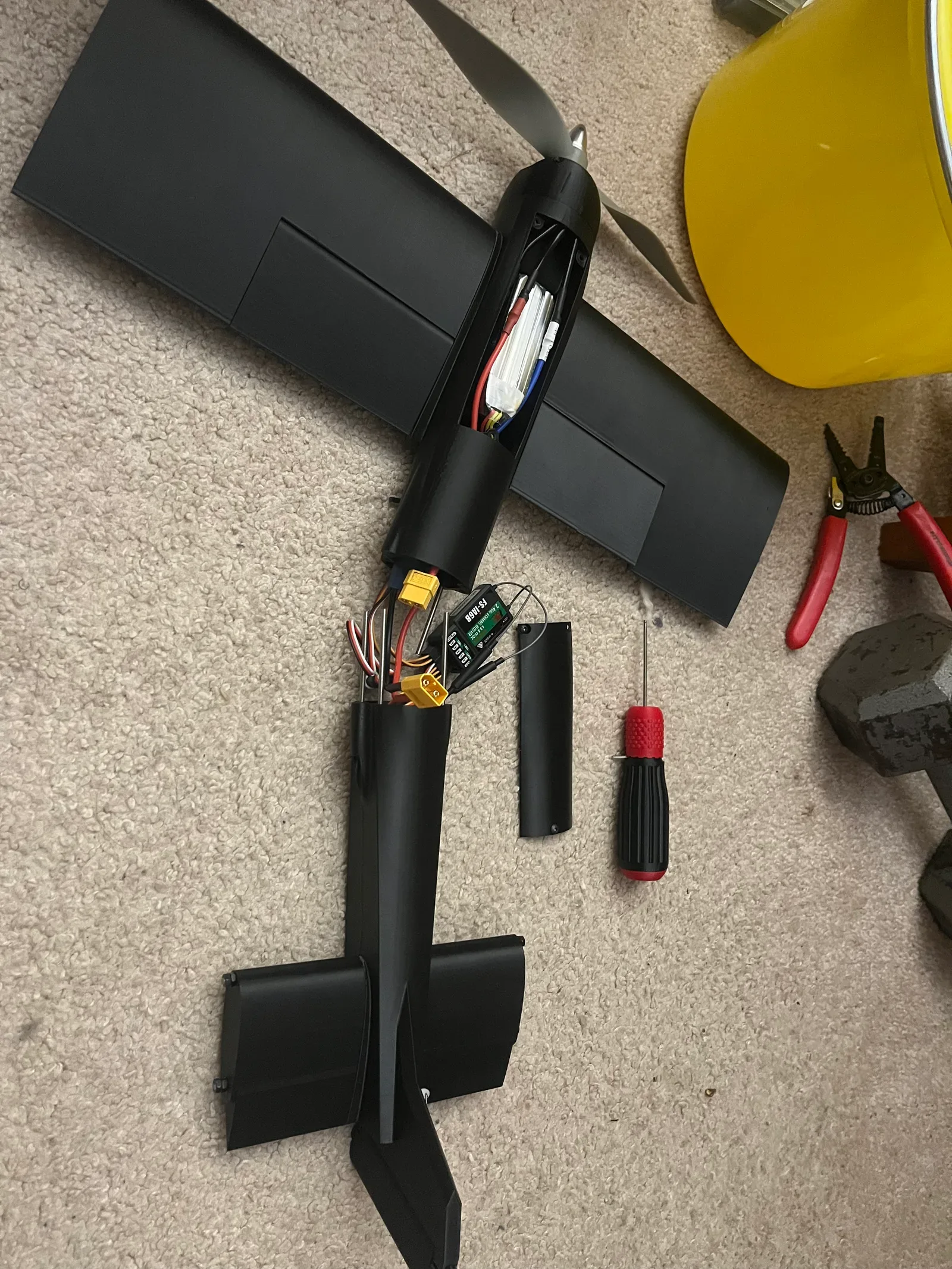 Black 3D-printed RC airplane during electronics assembly