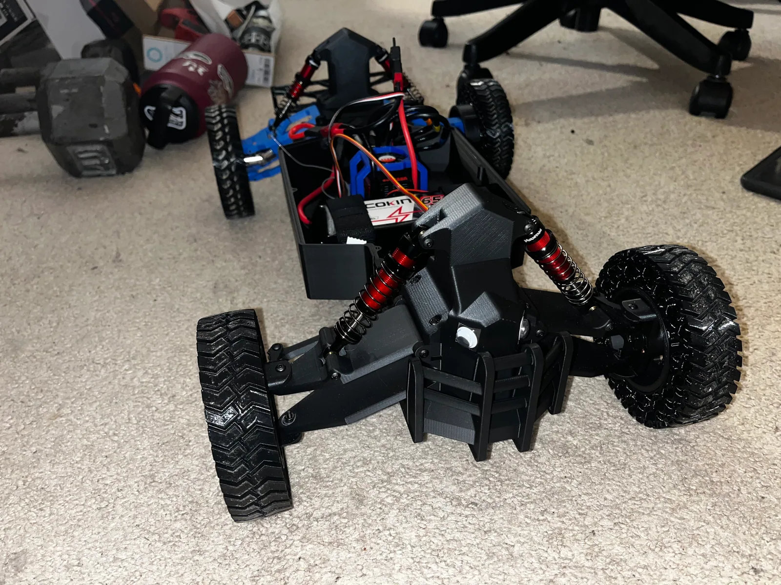 RC car suspension with a broken printed wishbone after testing